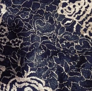 This is a lace floral gold and black crop top